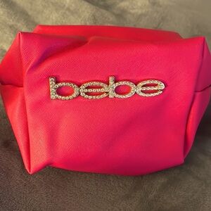 A cute little and spacious pink makeup bag